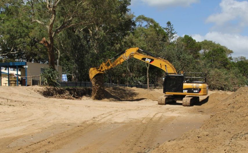Earthmoving machinery at work on the beach at Torquay. Earthmoving machinery at work on the beach at Torquay.
